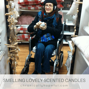 Smelling scented candles out in a real shop