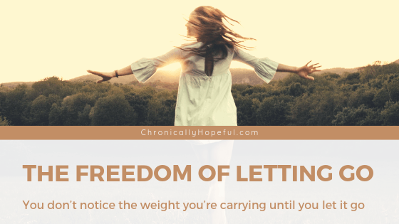 A woman dancing in a field at sunset. TItle reads: the freedom of letting go. You don't notice the weight you're carrying until you let it go.