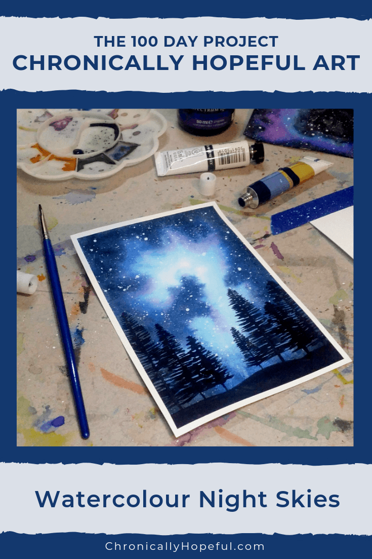 Flatlay of watercolour night sky, paint and brushes on the table around it. Title reads The 100 day project, Chronically Hopeful Art, Watercolour Night Skies.