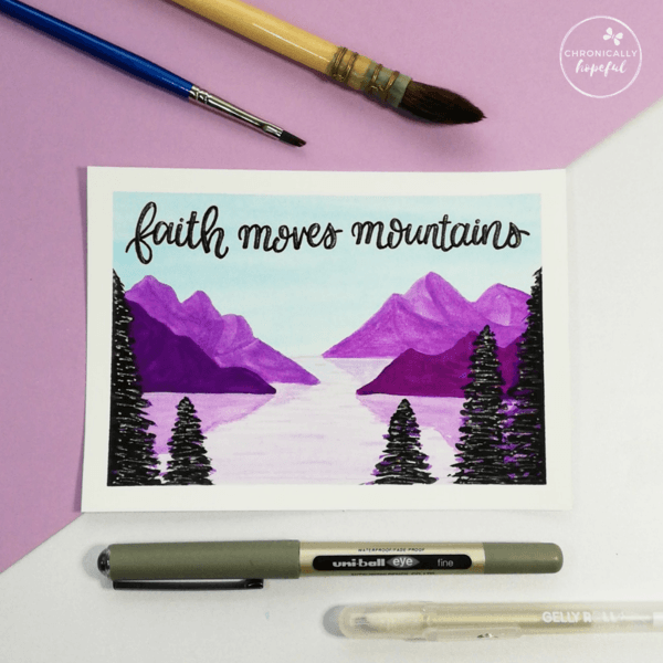 Daytime lake and mountains scene in purple watercolour, with 5 conifers in the foreground, the words Faith moves mountains lettered above the mountains, by Chronicaly Hopeful Char