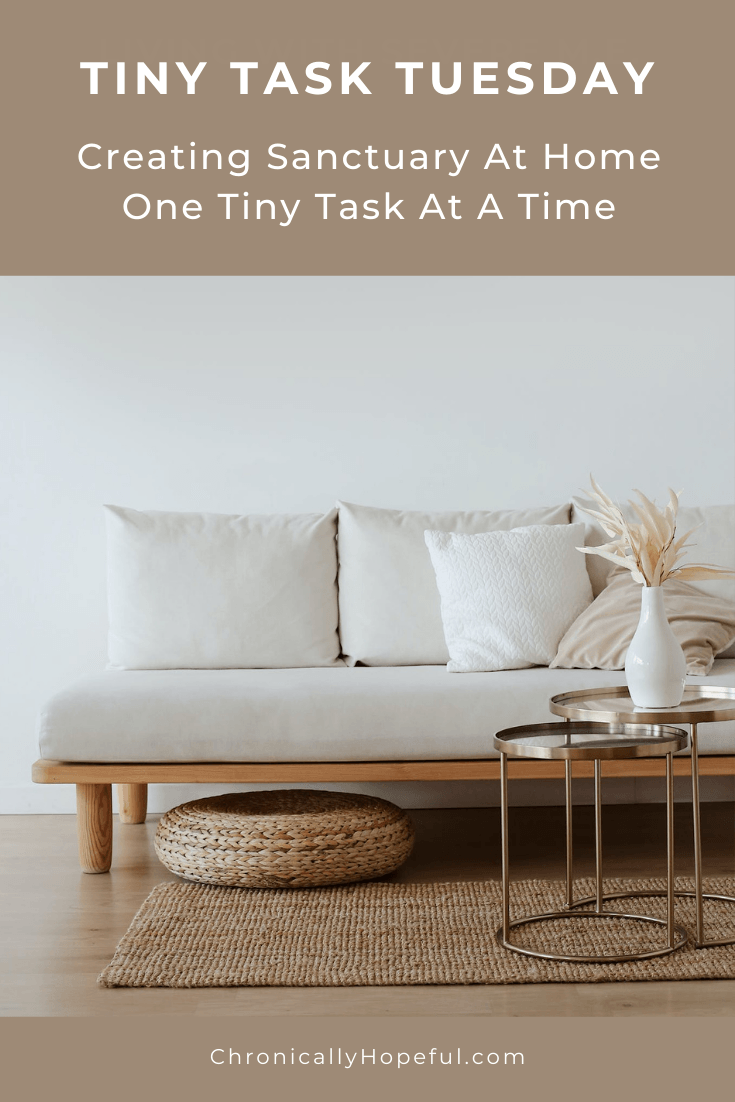 A sofa with comfy cushions and a vase of dried flowers on a copper table. Title reads: Tiny task Tuesday, Creating sanctuary at home, one tiny task at a time
