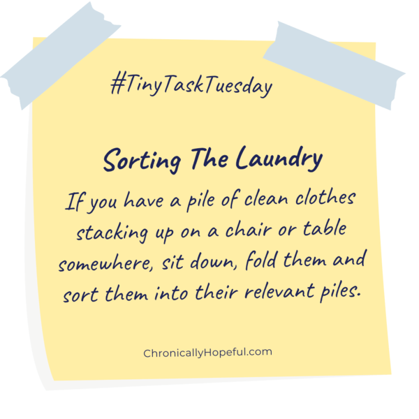 A post-it note with this week's Tiny Task Tuesday, sort the clean laundry