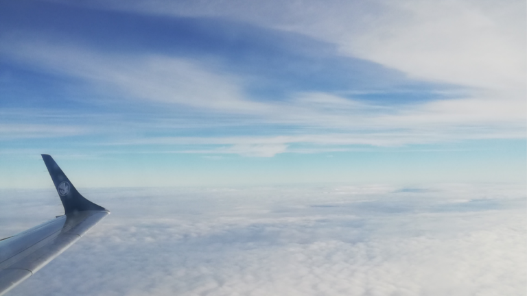Featured Image: aeroplane wing above the clouds by Chronically Hopeful